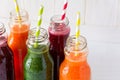 Detox drinks in bottles: fresh smoothies from vegetables: beet, carrot, spinach, cucumber and apple Royalty Free Stock Photo