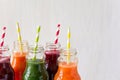 Detox drinks in bottles: fresh smoothies from vegetables: beet, carrot, spinach, cucumber and apple Royalty Free Stock Photo