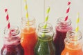 Detox drinks in bottles: fresh smoothies from vegetables: beet, carrot, spinach, cucumber and apple