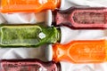 Detox drinks in bottles: fresh smoothies from vegetables: beet, carrot, spinach, cucumber and apple Royalty Free Stock Photo