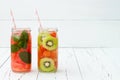 Detox fruit infused flavored water. Refreshing summer homemade cocktail. Clean eating. Copy space background Royalty Free Stock Photo