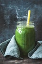 Detox green smoothie in bottle glass with drinking straw Royalty Free Stock Photo