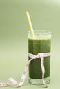 Detox green smoothie glass for loose weigh, dieting, green background. Healthy food Royalty Free Stock Photo