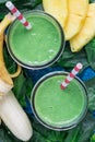 Detox green smoothie with spinach, pineapple, banana and yogurt, top view, closeup Royalty Free Stock Photo