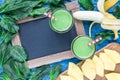 Detox green smoothie with spinach, pineapple, banana and yogurt, top view, copy space Royalty Free Stock Photo