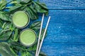 Detox green smoothie with spinach, pineapple, banana and yogurt, top view, copy space Royalty Free Stock Photo