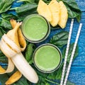 Detox green smoothie with spinach, pineapple, banana and yogurt, top view, square Royalty Free Stock Photo