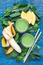 Detox green smoothie with spinach, pineapple, banana and yogurt, top view Royalty Free Stock Photo