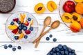 Detox and healthy superfoods breakfast bowl concept. Vegan coconut milk chia seeds pudding over rustic table with various fruits Royalty Free Stock Photo