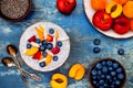 Detox and healthy superfoods breakfast bowl concept. Vegan coconut milk chia seeds pudding over rustic table with various fruits