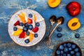 Detox and healthy superfoods breakfast bowl concept. Vegan coconut milk chia seeds pudding over rustic table with various fruits