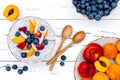 Detox and healthy superfoods breakfast bowl concept. Vegan coconut milk chia seeds pudding over rustic table with various fruits