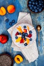 Detox and healthy superfoods breakfast bowl concept. Vegan coconut milk chia seeds pudding over rustic table with various fruits Royalty Free Stock Photo