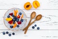 Detox and healthy superfoods breakfast bowl concept. Vegan coconut milk chia seeds pudding over rustic table with various fruits Royalty Free Stock Photo