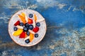 Detox and healthy superfoods breakfast bowl concept. Vegan coconut milk chia seeds pudding over rustic table with various fruits Royalty Free Stock Photo