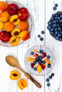 Detox and healthy superfoods breakfast bowl concept. Vegan coconut milk chia seeds pudding with various fruits and blueberries. Royalty Free Stock Photo