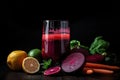 detox juice with beets, carrots, and ginger sitting on sleek black background Royalty Free Stock Photo