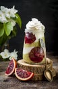 Detox layered matcha green tea chia seed pudding with blood oranges. Vegan dessert with coconut whipped cream.