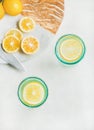 Detox lemon water in glasses, top view, copy space