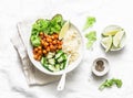 Detox moroccan spiced chickpea glow bowl on a light background, top view. Vegetarian food