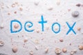 Detox salt with marine shells background. Healthy concept