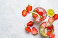 Detox sassy water with strawberries and lime in glasses, top view. Healthy eating concept