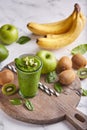 Detox smoothie with kiwi fruit, green apples, avocado, spinach and bananas Royalty Free Stock Photo