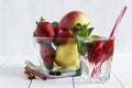 Detox water cocktail. Fresh vegetables and fruits in a glass bowl. Strawberry, apple, cucumber, lemon and mint. Royalty Free Stock Photo