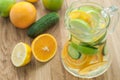 detox water with cucumber, lime, apple and orange for weightloss Royalty Free Stock Photo