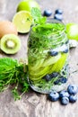 Detox water. Homemade summer fruit drink with lime and kiwi and Royalty Free Stock Photo