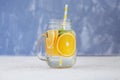 Detox water with lemon, orange and mint. Glass jar and tubule.The concept is summer, diet, vegetarian, fitness, healthy eating