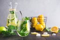 Detox lemonade with mint, citrics in glass on grey Royalty Free Stock Photo