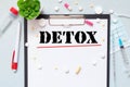 detox of the word on paper. concept. Words of detox on a wooden background Royalty Free Stock Photo