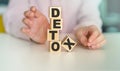 Detox word wooden cubes on light background