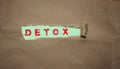 Detox word written under brown packing torn paper. Healthcare concept Royalty Free Stock Photo