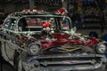 Close-up of a Chevrolet Bel Air interpretation with custom painted flames, at Detroit Autorama