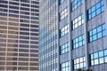 Row of glass windows on multiple tall buildings in downtown Detroit