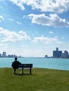 Detroit, Michigan April 11, 2020, Lone man on Bench, at Mid-day as Coronavirus scare has Governor enact `Stay At Home Order`