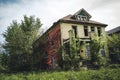 Detroit, Michigan, May 18, 2018: Abandoned and damaged single family home near downtown Detroit.