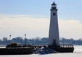 Detroit riverfront lighthouse during cold winter facing Canada
