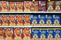 Grocery store shelf with boxes of various brands of breakfast cereal. Royalty Free Stock Photo