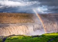 Dettifoss waterfall and rainbow, Iceland. Famous place in Iceland. A mountain valley and clouds after rain. Natural landscape in s Royalty Free Stock Photo