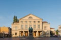 Deutsches Nationaltheater und Staatskapelle Weimar am Theaterplatz am Morgen bei Sonne und blauem Himmel
