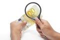 Devaluated euro under scrutiny Royalty Free Stock Photo