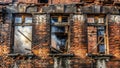 Devastated Brick Wall and Charred Beams A Grim Aftermath of a Fierce Fire Royalty Free Stock Photo