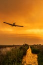 Devastating wildfire in Alexandroupolis Evros Greece, Aerial firefighting waterbombing planes, smoke covered the sky, sunset