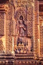 Devata or Goddess carved into the red sandstone walls, Banteay Srei temple, Siem Reap, Cambodia Royalty Free Stock Photo