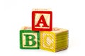 Develop and educate preschool kid, kindergarten class and learning the alphabet conceptual idea with colorful wooden toy blocks