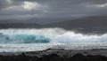 North east  coast of Gran Canaria, powerful ocean waves broought in by distant Epsilon hurricane breaking by the shore Royalty Free Stock Photo