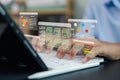 Developer coding data analysis dashboard on laptop with virtual interface, software engineer programming digital system Royalty Free Stock Photo